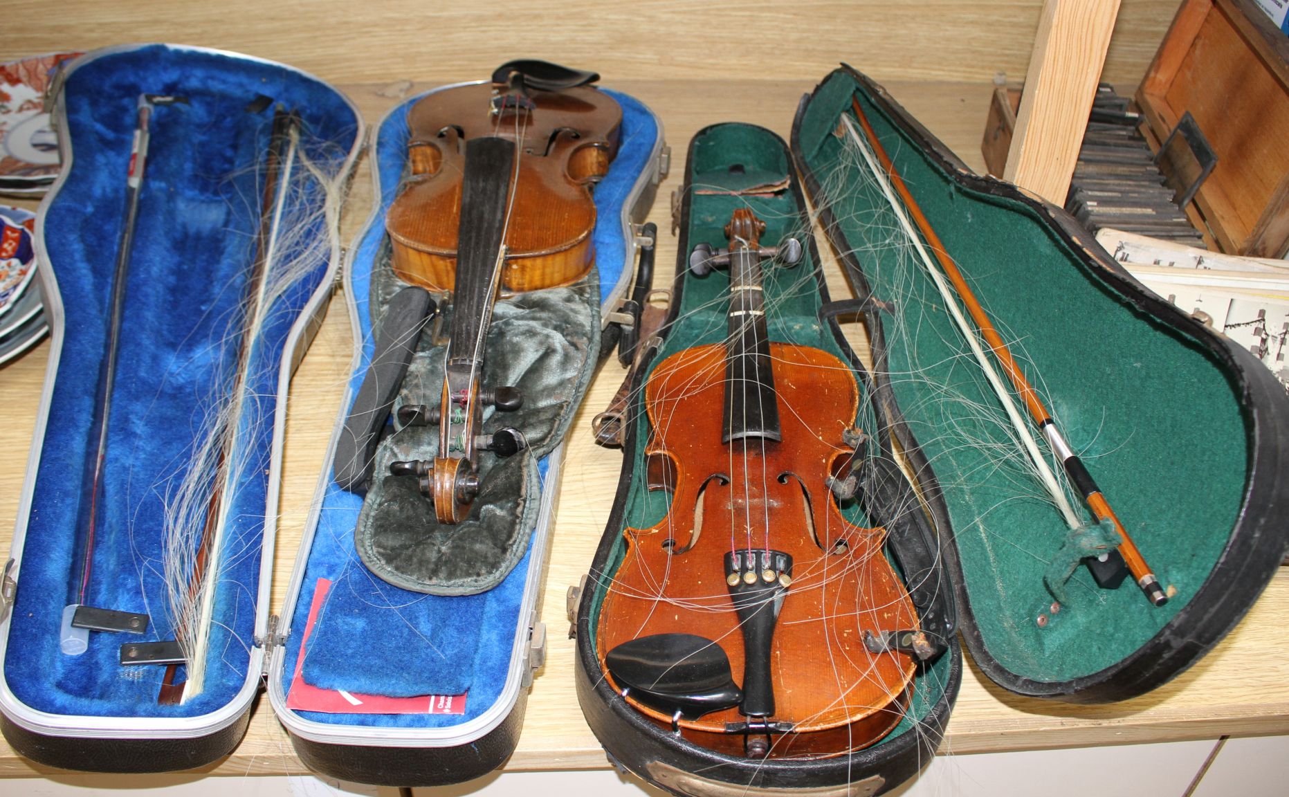 A violin with two piece back and bow, and a child's violin with bow, both with cases Condition:- - Image 23 of 44