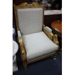 A French Empire carved giltwood armchair, W.76cm D.76cm H.116cm Condition: Seat cushion slightly