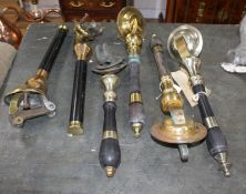 Two pairs of brass mounted beer pumps and two single pumps, largest 46cm Condition: Some wear from