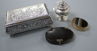 A George IV silver pepperette, a continental repousse white metal trinket box, a tortoiseshell