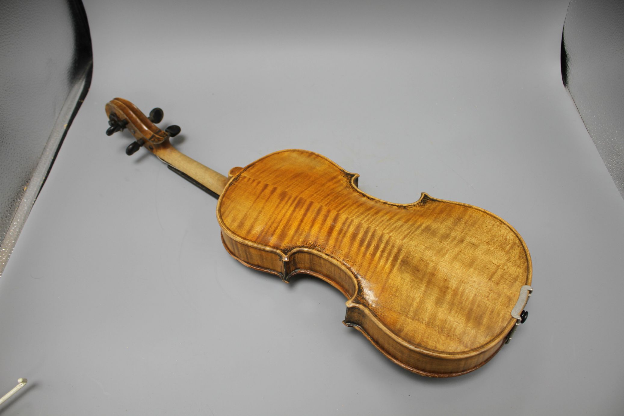 A violin with two piece back and bow, and a child's violin with bow, both with cases Condition:- - Image 30 of 44