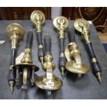 A set of four brass mounted ebony beer pumps, 46cm, another pair and one other beer pump