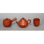 A Chinese Yixing teapot and cover, a redware teapot and cover and a cup Condition: All in very