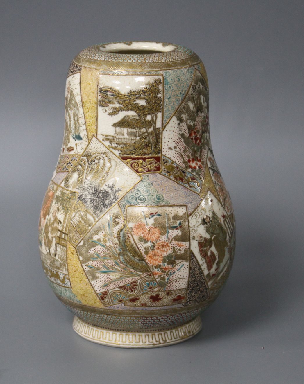 A Satsuma gourd shaped vase, decorated with panels of figures, flowers and landscapes, height 12cm