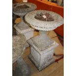 A pair of reconstituted stone campana garden urns on square pedestals, H.94cm Diam.55cm Condition: