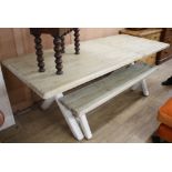 A Loaf pine extending refectory table, extended L.215.5cm W.89.5cm H.77cm, with painted X frame,