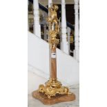 An ornate Italian gilt metal and marble centrepiece, modelled with a huntsman blowing his horn,