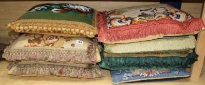 Seven antique / antique fabric cushions Condition:- pair of floral tapestry panel cushions with