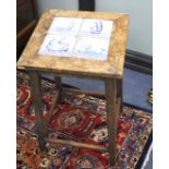 An early 20th century square pine occasional table, inset four Delft tiles, top 38cm sq., H.64cm