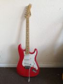 A Rockburn electric guitar Condition: Electrics all working, whammy bar is wrapped in foil, chips