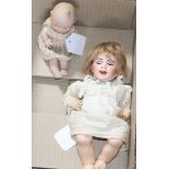 An SFBJ 23b doll,10in., firing fault to rim of head and a Heubach bisque baby, 5in.