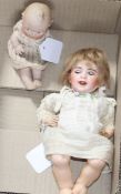 An SFBJ 23b doll,10in., firing fault to rim of head and a Heubach bisque baby, 5in.