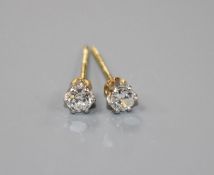 A pair of yellow metal and solitaire diamond earstuds, butterflies stamped 375, gross weight 1.1