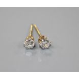 A pair of yellow metal and solitaire diamond earstuds, butterflies stamped 375, gross weight 1.1