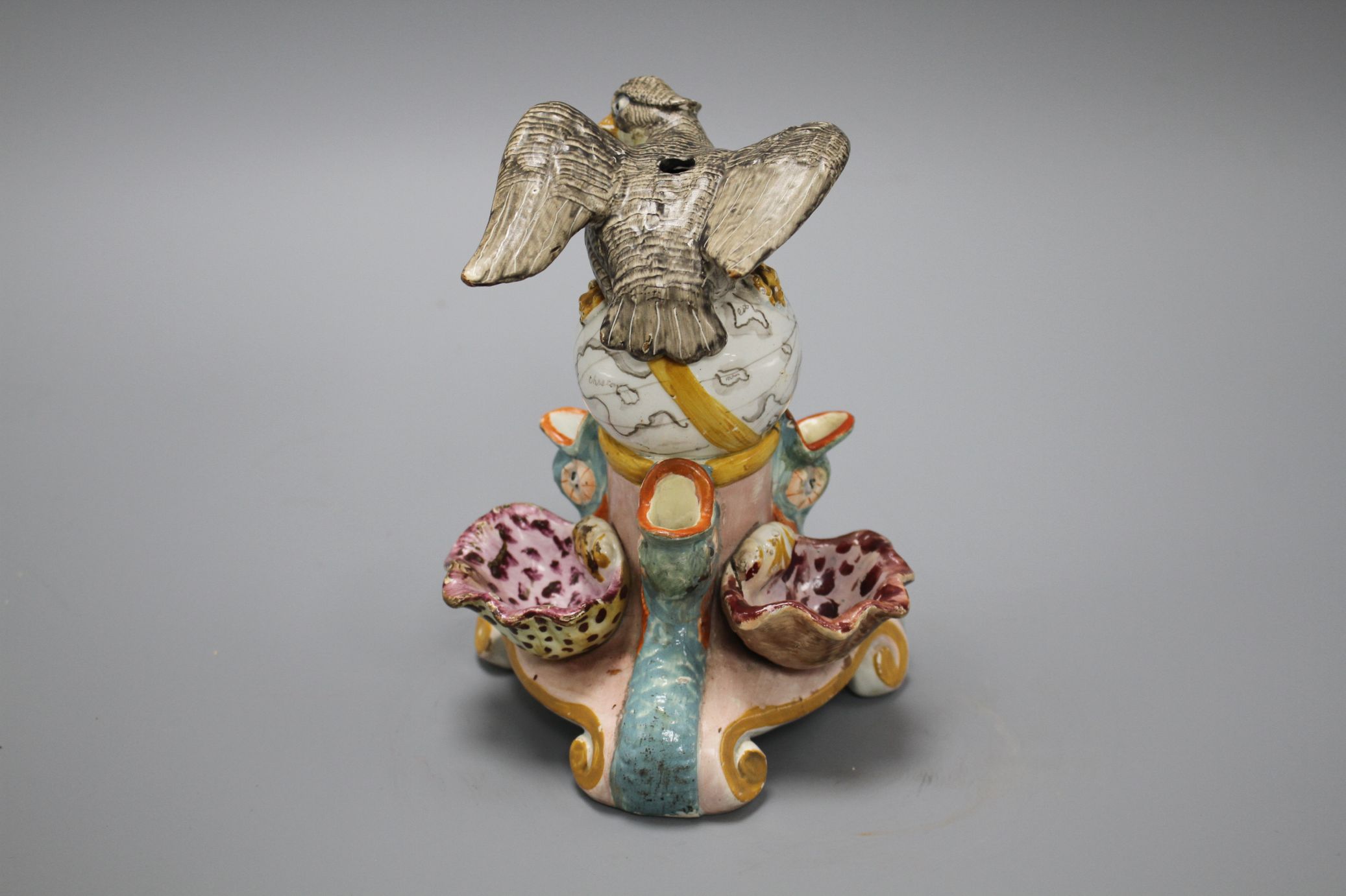 An early 19th century Staffordshire inkwell, modelled with an eagle perched upon a globe above three - Image 3 of 6