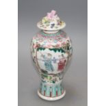 A 19th century Chinese famille rose baluster vase and cover, height 24cm Condition: Top finial