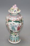 A 19th century Chinese famille rose baluster vase and cover, height 24cm Condition: Top finial