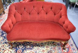 A Victorian small upholstered two-seater settee, W.130cm D.74cm H.78cm Condition: The red velvet