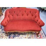 A Victorian small upholstered two-seater settee, W.130cm D.74cm H.78cm Condition: The red velvet