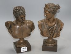 A pair of bronzed resin busts of Diana and Apollo, on integral bases, height 30cm Condition: Small