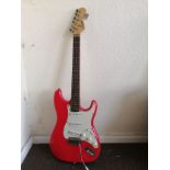 A Squier Strat electric guitar Condition: Electrics all working, some crackle to input selectors and