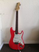 A Squier Strat electric guitar Condition: Electrics all working, some crackle to input selectors and