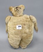 An early 20th century gold plush teddy bear hand warmer, with boot button eyes, length 40cm