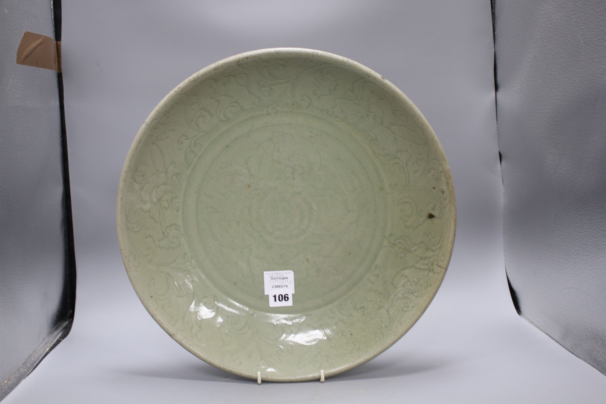 A 15th / 16th century Longquan celadon dish, incised with flowers, diameter 43cm, height 8.5cm - Image 2 of 12