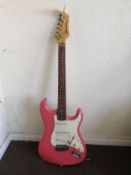 An AXL Player Deluxe electric guitar Condition: Electrics are all working, crackle to selector