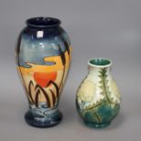 Two modern Moorcroft vases, one decorated with bulrushes and sunset, height 31cm, the other with