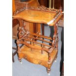 A Victorian walnut whatnot canterbury, with serpentine front and base drawer, W.58cm D.36cm H.97cm