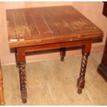 A 1920s oak draw leaf dining table, top 76cm sq. H.75cm Condition: The top is badly marked all over,