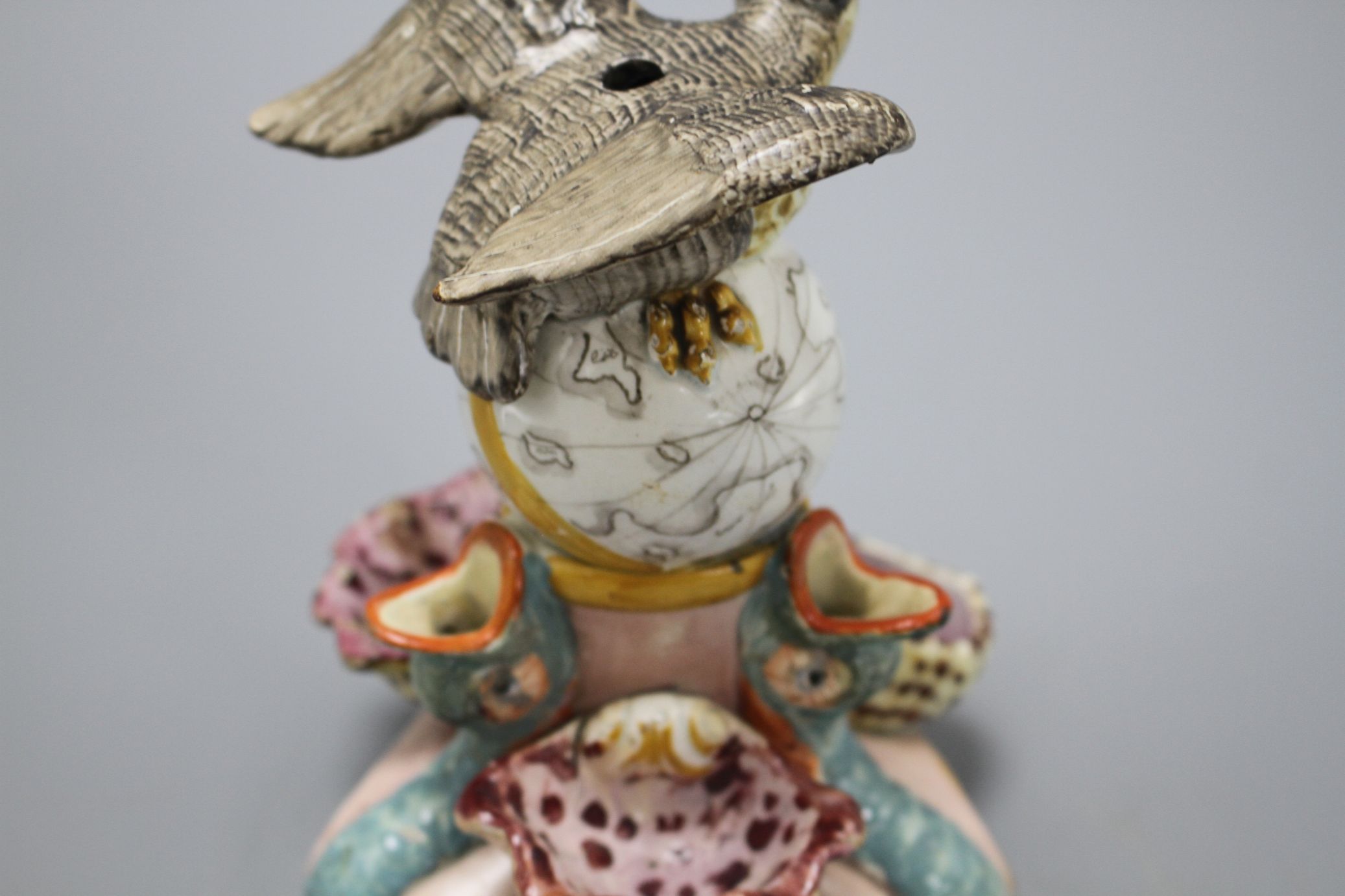 An early 19th century Staffordshire inkwell, modelled with an eagle perched upon a globe above three - Image 5 of 6