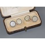 A pair of yellow metal (stamped TM 18ct), mother of pearl and enamel disc cufflinks, gross weight 10