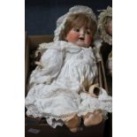 An AM 1894 doll, 18in. and a Heubach doll, bent limb, lower detached, 22in. (a.f.) (2)