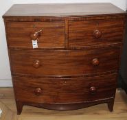 A Regency mahogany bowfront chest of two short and two graduated long drawers, on swept bracket