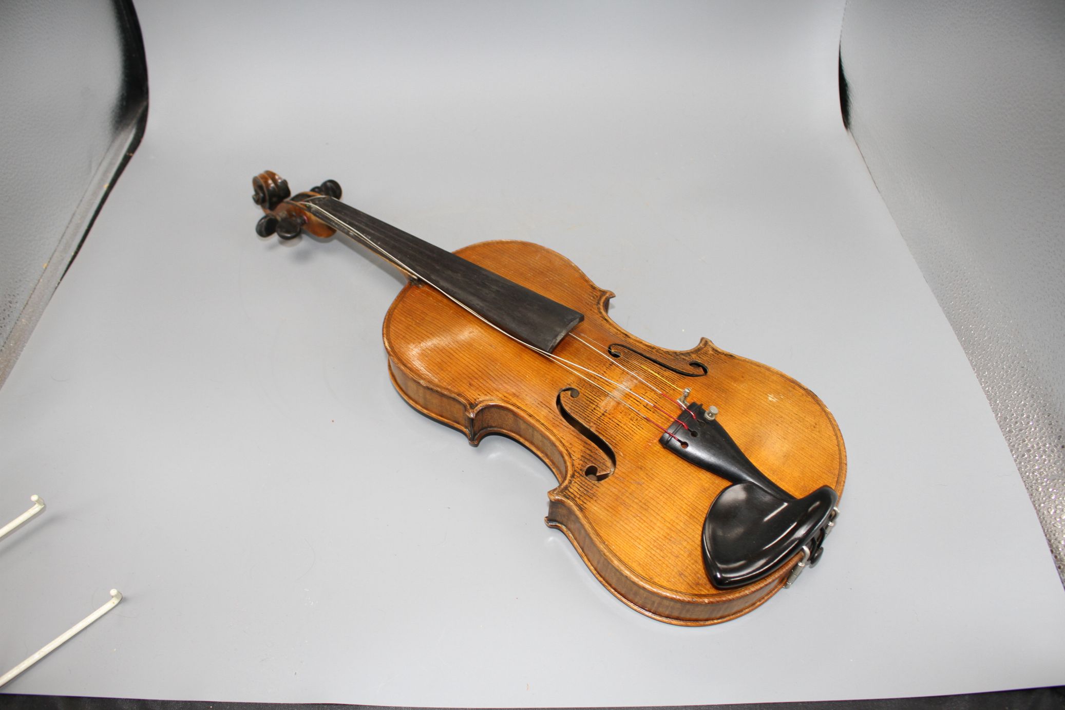 A violin with two piece back and bow, and a child's violin with bow, both with cases Condition:- - Image 4 of 44