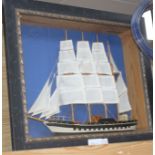 A painted wood ship model, in display frame, overall 42 x 52cm Condition: Sails looks a little faded