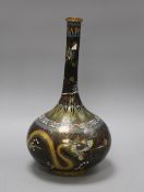 An early 20th century Chinese cloisonne vase, decorated with dragons on a black ground, height