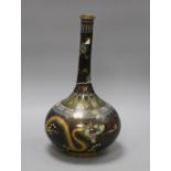 An early 20th century Chinese cloisonne vase, decorated with dragons on a black ground, height