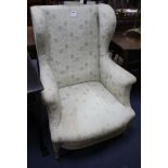 A Louis XVI wing armchair with painted beech underframe, W.75cm D.80cm H.102cm Condition: Upholstery