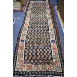 A Shah Savan Kelim runner, with central black ground of stylised floral motifs, 242 x 98cm