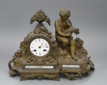 A late 19th century French ormolu mantel clock, with enamelled dial signed C. Detouche... Paris,