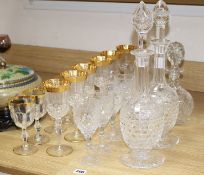 A pair of Stuart? cut glass decanters and stoppers, another decanter, a set of eight vineous