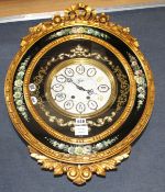 An ornate gold and floral painted electric wall clock, W.48cm H.68cm Condition: Two of the numbers