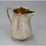 A 1970's silver cream jug by Brian Leslie Fuller, London, 1977, height 92mm, 5.5 oz. Condition: Some