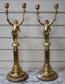 A pair of Italian gilt metal candelabra, with putto stems and marble bases, height 51cm Condition: