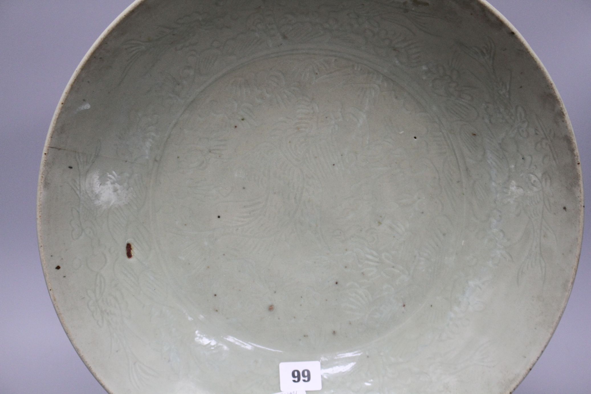 A Chinese Ming celadon dish, Zhangzhou kilns, c.1580-1620, incised with fish and water plants, - Image 3 of 5