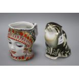 A Russian ceramic figure of a seated cat, height 15cm, and a character jug depicting a woman's