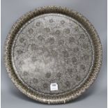 A Cairoware brass inset pewter tray, diameter 54cm Condition: Some small areas of flaking to the